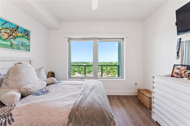 bedroom with wood finished floors, ceiling fan, and baseboards