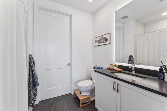 bathroom with visible vents, toilet, recessed lighting, vanity, and tile patterned floors