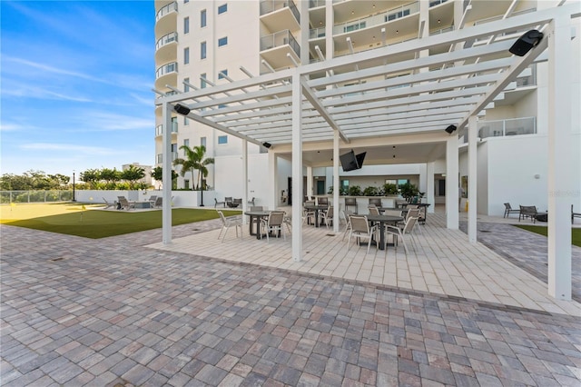 view of patio featuring a pergola and outdoor dining area