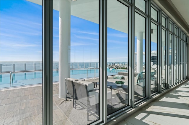 balcony featuring a water view