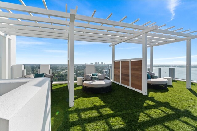 view of yard with a pergola and a water view