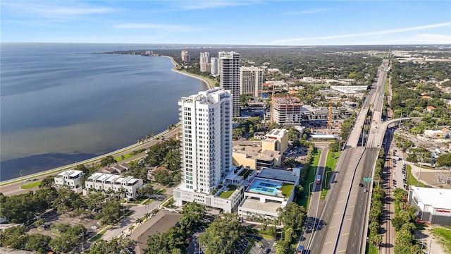 drone / aerial view featuring a water view and a view of city