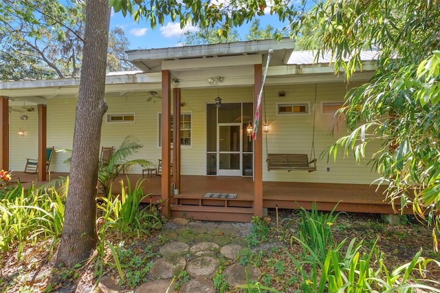 187 Sage Cir, Crystal Beach, FL 34681 - back of house with a porch