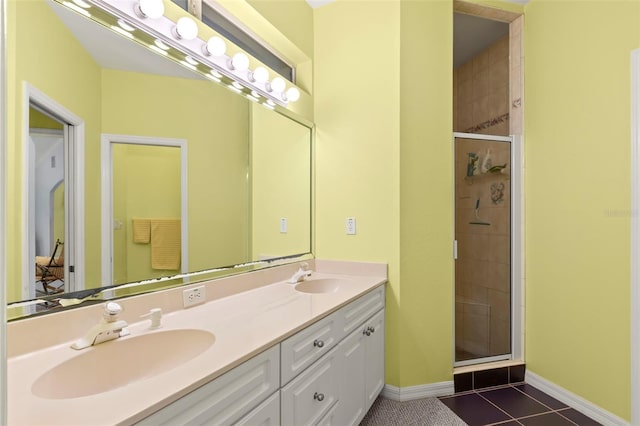 187 Sage Cir, Crystal Beach, FL 34681 - full bath featuring a stall shower, baseboards, double vanity, and tile patterned floors