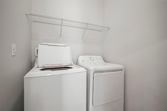 laundry room with washer and dryer and laundry area