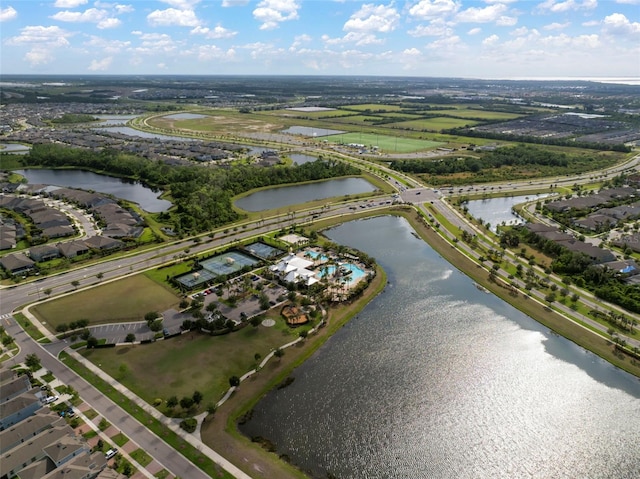drone / aerial view featuring a residential view and a water view