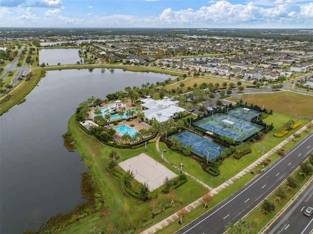 bird's eye view featuring a residential view and a water view