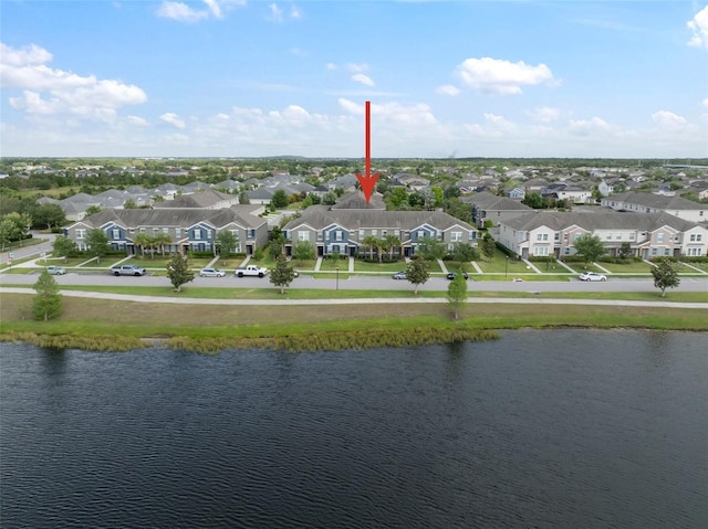 bird's eye view featuring a water view and a residential view