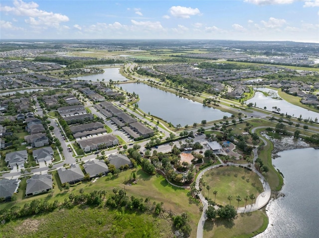 drone / aerial view featuring a water view and a residential view