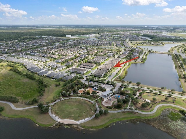 birds eye view of property with a water view and a residential view