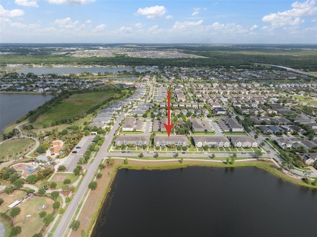 birds eye view of property with a residential view and a water view