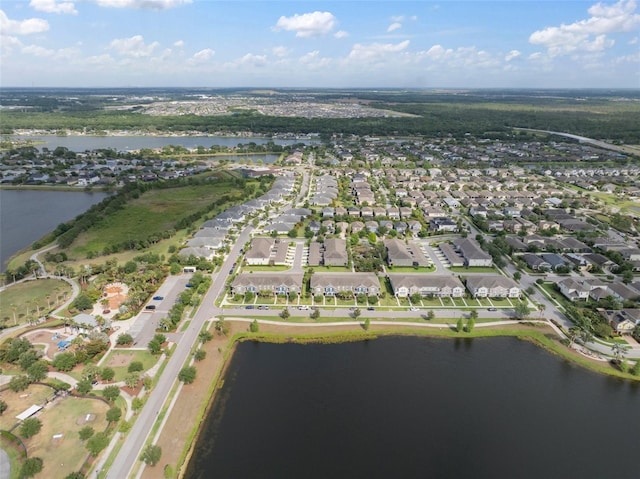 bird's eye view featuring a residential view and a water view