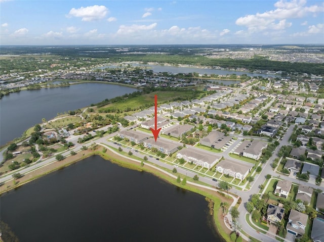 birds eye view of property with a residential view and a water view