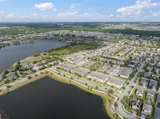birds eye view of property featuring a water view and a residential view