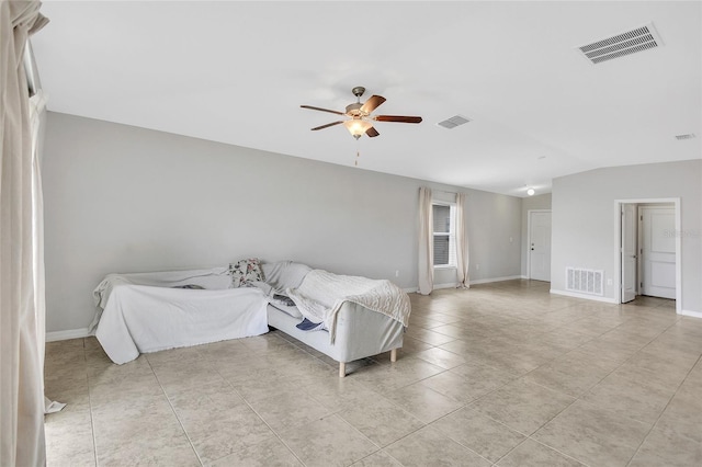 unfurnished bedroom featuring light tile patterned floors, visible vents, and vaulted ceiling