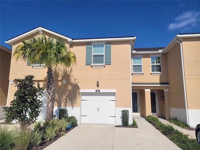 5509 Cumberland Star Ct, Lutz, FL 33558 - multi unit property with stucco siding, a garage, and driveway