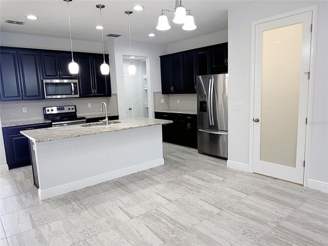 5509 Cumberland Star Ct, Lutz, FL 33558 - kitchen featuring stainless steel appliances, a sink, backsplash, light stone counters, and recessed lighting
