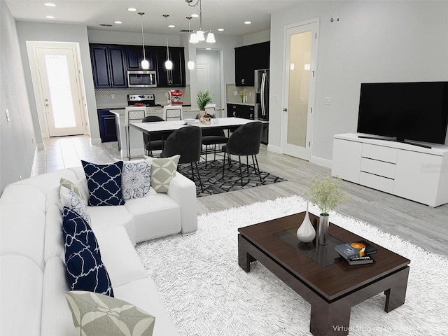 5509 Cumberland Star Ct, Lutz, FL 33558 - living area featuring baseboards, recessed lighting, and light wood finished floors