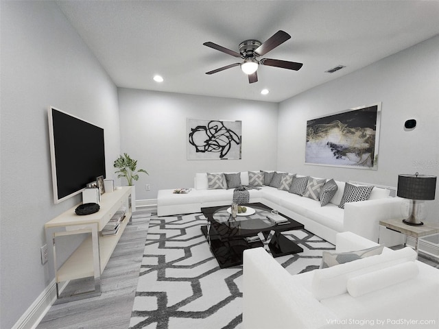 5509 Cumberland Star Ct, Lutz, FL 33558 - living area featuring wood finished floors, ceiling fan, recessed lighting, and baseboards