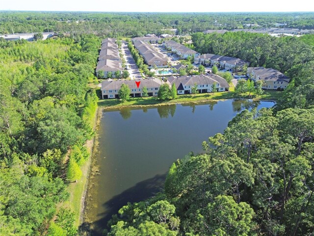 5509 Cumberland Star Ct, Lutz, FL 33558 - aerial view of residential area with a nearby body of water and a forest