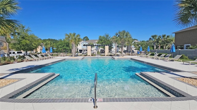 5509 Cumberland Star Ct, Lutz, FL 33558 - community pool featuring a patio and fence