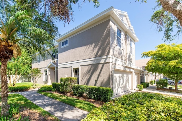 view of home's exterior featuring stucco siding and an attached garage