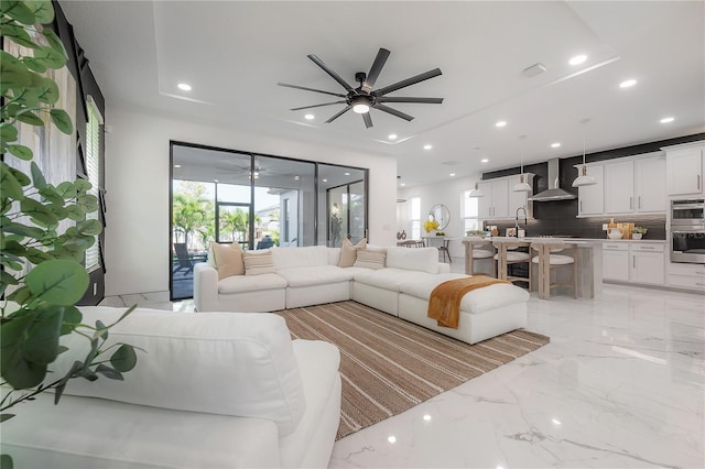 19554 Roseate Dr, Lutz, FL 33558 - living area with marble finish floor, ceiling fan, and recessed lighting