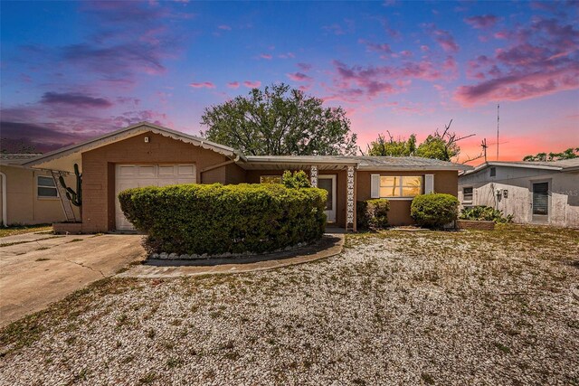 1051 Normandy Blvd, Holiday, FL 34691 - single story home with an attached garage and concrete driveway