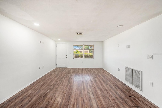 1051 Normandy Blvd, Holiday, FL 34691 - spare room featuring baseboards, wood finished floors, and visible vents