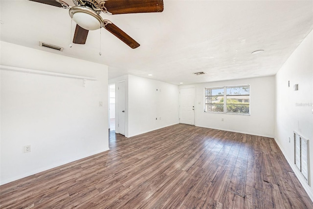 1051 Normandy Blvd, Holiday, FL 34691 - unfurnished living room featuring wood finished floors, visible vents, and ceiling fan