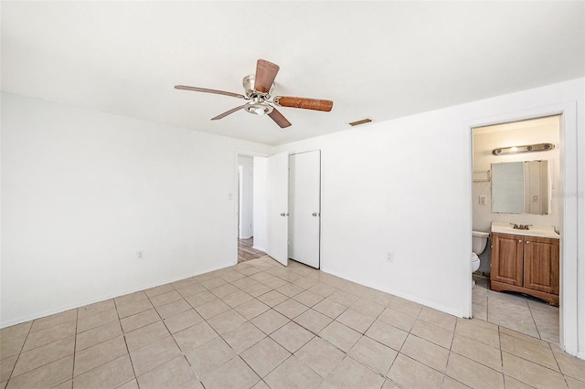 1051 Normandy Blvd, Holiday, FL 34691 - unfurnished bedroom featuring visible vents, a ceiling fan, light tile patterned floors, a sink, and a closet