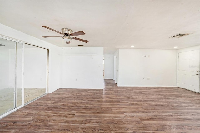 1051 Normandy Blvd, Holiday, FL 34691 - unfurnished living room with a ceiling fan, wood finished floors, visible vents, and recessed lighting