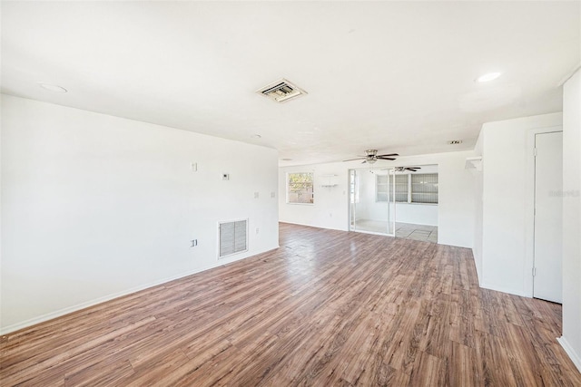 1051 Normandy Blvd, Holiday, FL 34691 - spare room with wood finished floors, visible vents, baseboards, and ceiling fan