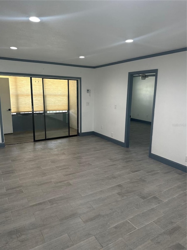 2275 62nd Ave N Unit 5202, Saint Petersburg, FL 33702 - spare room with crown molding, baseboards, recessed lighting, and wood finished floors