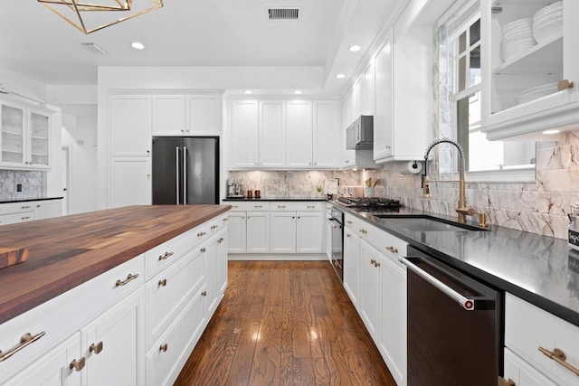 3325 W Wallcraft Ave, Tampa, FL 33611 - kitchen featuring butcher block countertops, a sink, dishwasher, high quality fridge, and visible vents