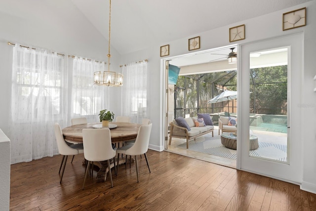 3325 W Wallcraft Ave, Tampa, FL 33611 - dining area featuring vaulted ceiling, hardwood / wood-style floors, a wealth of natural light, and ceiling fan with notable chandelier