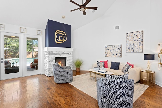 3325 W Wallcraft Ave, Tampa, FL 33611 - living room with visible vents, a ceiling fan, wood-type flooring, baseboards, and high vaulted ceiling