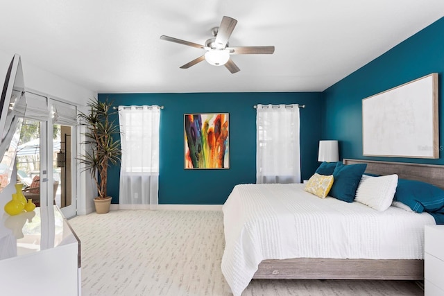 3325 W Wallcraft Ave, Tampa, FL 33611 - bedroom with baseboards, a ceiling fan, and access to outside
