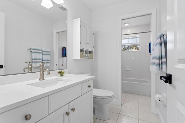 3325 W Wallcraft Ave, Tampa, FL 33611 - bathroom with a skylight, vanity, toilet, tile patterned flooring, and visible vents