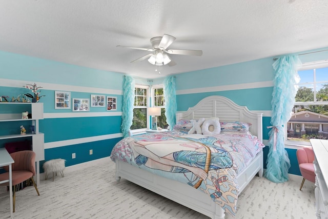 3325 W Wallcraft Ave, Tampa, FL 33611 - carpeted bedroom with a ceiling fan, baseboards, and a textured ceiling