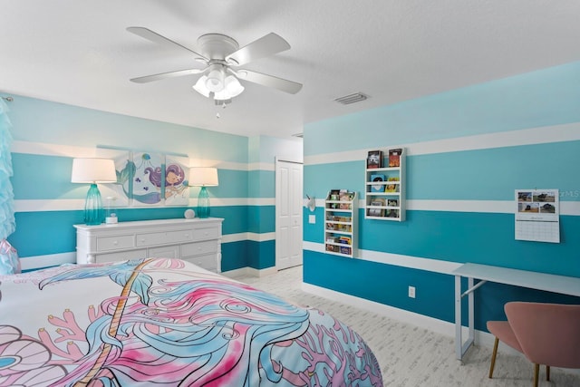 3325 W Wallcraft Ave, Tampa, FL 33611 - bedroom with baseboards, visible vents, light colored carpet, a ceiling fan, and a closet