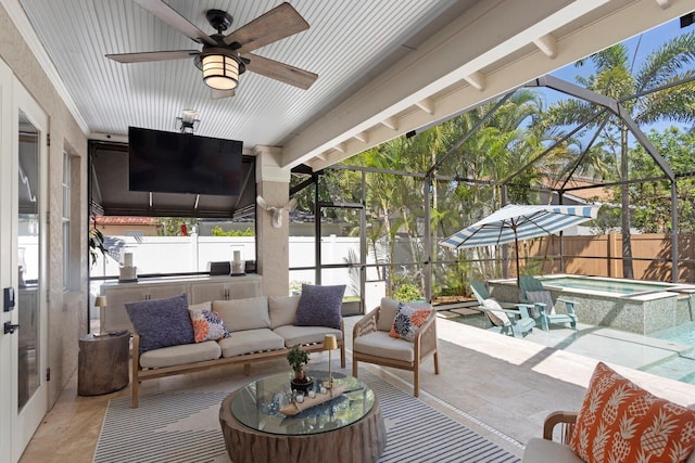3325 W Wallcraft Ave, Tampa, FL 33611 - view of patio with a ceiling fan, a lanai, a fenced backyard, and an outdoor living space