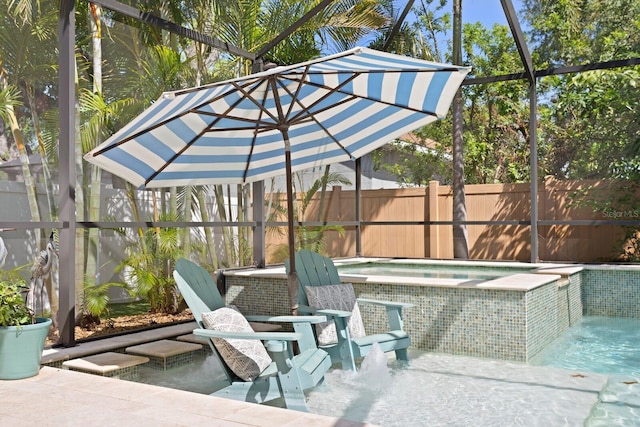 3325 W Wallcraft Ave, Tampa, FL 33611 - view of patio featuring a fenced backyard and an in ground hot tub