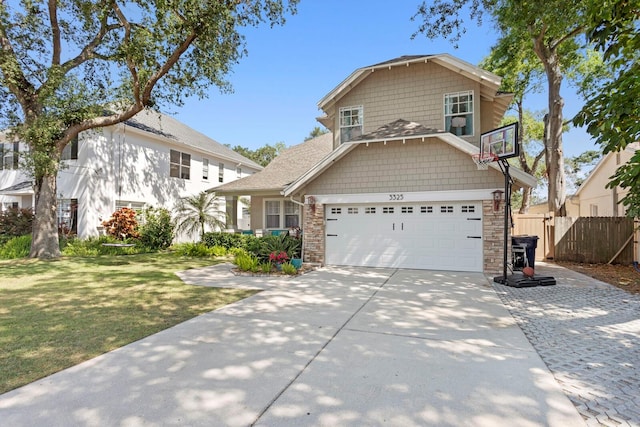 3325 W Wallcraft Ave, Tampa, FL 33611 - traditional-style house featuring a front lawn, stone siding, concrete driveway, fence, and an attached garage