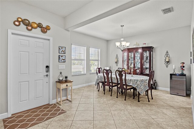 21383 Southern Charm Dr, Land O Lakes, FL 34637 - dining space featuring visible vents, baseboards, an inviting chandelier, and light tile patterned floors