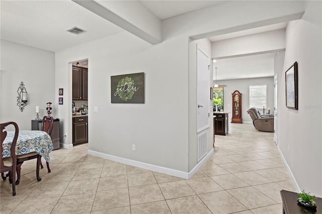 21383 Southern Charm Dr, Land O Lakes, FL 34637 - corridor with light tile patterned floors, visible vents, and baseboards