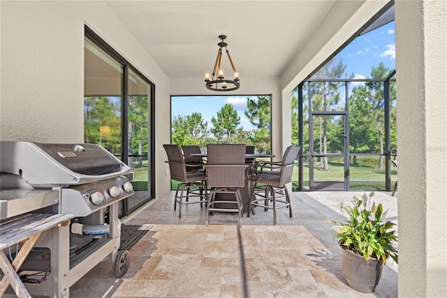 21383 Southern Charm Dr, Land O Lakes, FL 34637 - sunroom featuring an inviting chandelier