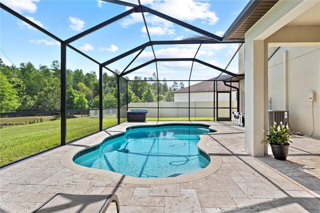 21383 Southern Charm Dr, Land O Lakes, FL 34637 - view of swimming pool with a patio area, a yard, fence, glass enclosure, and a fenced in pool