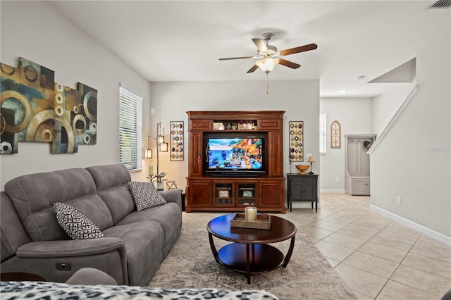 21383 Southern Charm Dr, Land O Lakes, FL 34637 - living room featuring light tile patterned floors, baseboards, a ceiling fan, and visible vents