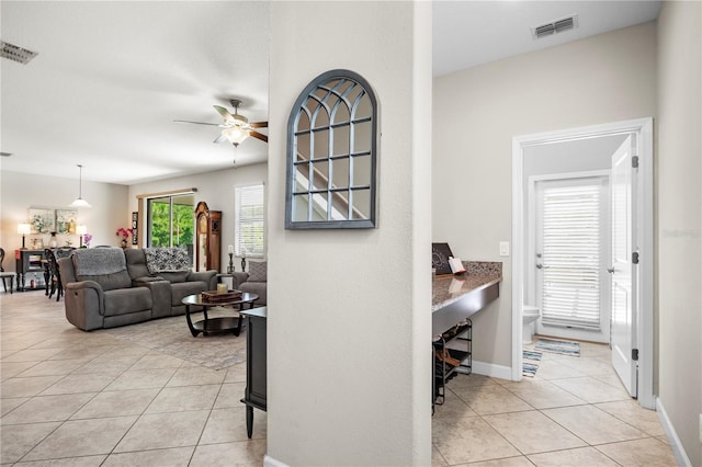21383 Southern Charm Dr, Land O Lakes, FL 34637 - hall with light tile patterned floors, visible vents, and baseboards